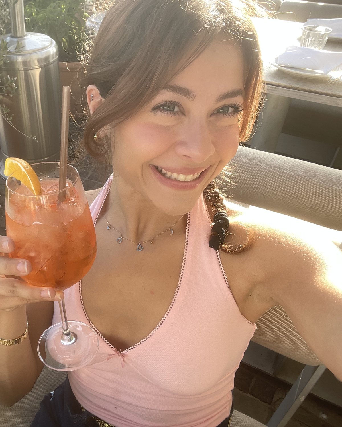 Tamara smiling on a sunny patio